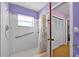 Bright bathroom features a walk-in shower with grab bars and a cheerful, clean design at 321 Belle View Ave, Temple Terrace, FL 33617