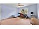 Bedroom featuring a window desk setup and a chair that nicely coordinates with the bed at 321 Belle View Ave, Temple Terrace, FL 33617
