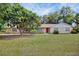 Charming brick home with a well-manicured lawn and mature tree in a desirable neighborhood at 321 Belle View Ave, Temple Terrace, FL 33617
