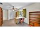 Home office with large window, built-in bookshelf, and chair at 321 Belle View Ave, Temple Terrace, FL 33617