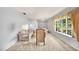 Light and airy living room featuring a large window and neutral decor at 321 Belle View Ave, Temple Terrace, FL 33617