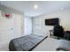 Bedroom featuring carpeted floors, a large window, and a built-in basketball hoop at 32451 Limitless Pl, Wesley Chapel, FL 33545