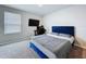 Bedroom featuring carpeted floors, large window, and work space at 32451 Limitless Pl, Wesley Chapel, FL 33545