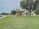 A fun playground with slides is nestled in a green space, providing a safe and enjoyable area for children at 32451 Limitless Pl, Wesley Chapel, FL 33545