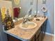 Bathroom featuring double sinks, vanity, and a large mirror at 3313 San Moise Pl, Plant City, FL 33567