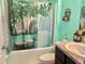 Bright bathroom featuring scenic shower curtain and neutral granite countertop at 3313 San Moise Pl, Plant City, FL 33567