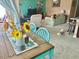 Cozy dining area with a rustic table, leading to the living room and kitchen at 3313 San Moise Pl, Plant City, FL 33567