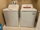 Laundry area features standard-size, white washing machine and dryer at 3313 San Moise Pl, Plant City, FL 33567
