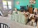 Bright living room features carpeted flooring, large windows and a comfortable sofa at 3313 San Moise Pl, Plant City, FL 33567