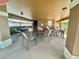 Community patio with tables and chairs, ideal for gatherings and outdoor relaxation at 3313 San Moise Pl, Plant City, FL 33567
