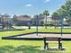Community playground featuring swings, slides, and seating areas in a Gathering-friendly neighborhood at 3313 San Moise Pl, Plant City, FL 33567
