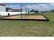 Community playground with swing set on green grass area for outdoor activity at 3313 San Moise Pl, Plant City, FL 33567