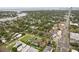 Wide aerial shot showcasing neighborhood with lush greenery and views of the nearby coast and cityscape at 333 30Th N Ave, St Petersburg, FL 33704