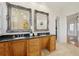 Bathroom with and sinks, granite counters and decorative framed mirrors at 333 30Th N Ave, St Petersburg, FL 33704