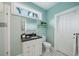 Updated bathroom with light blue walls, vanity with granite counters and a glass shower at 333 30Th N Ave, St Petersburg, FL 33704