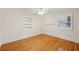 Cozy bedroom with gorgeous hardwood floors, a built-in bookshelf, and plantation shutters at 333 30Th N Ave, St Petersburg, FL 33704