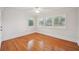Bright, empty bedroom with hardwood floors, white trim, neutral paint, and shuttered windows at 333 30Th N Ave, St Petersburg, FL 33704