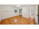 Bedroom featuring gleaming hardwood floors, a closet, and a window with plantation shutters at 333 30Th N Ave, St Petersburg, FL 33704