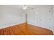 Bright bedroom featuring hardwood floors, fresh paint, base moulding, and closet with panel doors at 333 30Th N Ave, St Petersburg, FL 33704