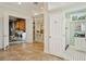Walkway between rooms featuring a closet with built-ins, a laundry room and entrance to the bathroom at 333 30Th N Ave, St Petersburg, FL 33704