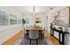 Elegant dining room with a long table, seating for six, hardwood floors, and sophisticated decor at 333 30Th N Ave, St Petersburg, FL 33704