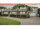 Charming single Gathering home featuring a neatly manicured lawn, lush landscaping, and a two car garage at 333 30Th N Ave, St Petersburg, FL 33704