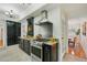 Well-equipped kitchen showcasing granite countertops, stainless steel appliances, dark cabinets, and an eat-in dining area at 333 30Th N Ave, St Petersburg, FL 33704