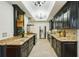 Modern kitchen featuring granite countertops, stainless steel appliances, dark cabinets, and ample counter space at 333 30Th N Ave, St Petersburg, FL 33704