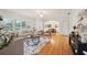 Bright living room featuring hardwood floors, large windows, and an open floor plan that leads to the dining room at 333 30Th N Ave, St Petersburg, FL 33704