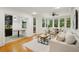 Inviting living room with hardwood floors, an open layout, and access to the kitchen and dining areas at 333 30Th N Ave, St Petersburg, FL 33704