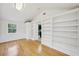 Living room with hardwood floors and built-in shelving at 333 30Th N Ave, St Petersburg, FL 33704