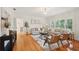 Well-lit living room featuring hardwood floors, white walls, and large windows with plantation shutters at 333 30Th N Ave, St Petersburg, FL 33704