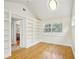 Living room with hardwood floors, large built-in shelving, and natural light from the exterior at 333 30Th N Ave, St Petersburg, FL 33704