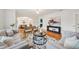 Cozy living room featuring an open floor plan, hardwood floors, stylish decor, and lots of natural light at 333 30Th N Ave, St Petersburg, FL 33704