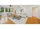 Bright living room featuring hardwood floors, an open floor plan, and access to dining area and kitchen at 333 30Th N Ave, St Petersburg, FL 33704
