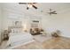 Bright and airy main bedroom features neutral tones, decorative molding, ceiling fans, and a sitting area at 333 30Th N Ave, St Petersburg, FL 33704