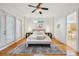 Spacious bedroom with hardwood floors, transom windows, and elegant furnishings at 333 30Th N Ave, St Petersburg, FL 33704