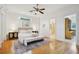 Bright bedroom with hardwood floors, transom windows, and an ensuite bathroom at 333 30Th N Ave, St Petersburg, FL 33704