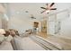 Large main bedroom with sitting area, ceiling fans, and entrances to the bathroom, laundry, and closet at 333 30Th N Ave, St Petersburg, FL 33704