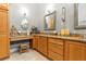 Bathroom featuring a granite countertop vanity with matching cabinet and decor at 3402 Melissa Country Way, Lutz, FL 33559