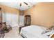Comfortable bedroom featuring a large closet, wooden dresser, rocking chair, and neutral walls at 3402 Melissa Country Way, Lutz, FL 33559