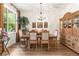 Elegant dining room with a large window and decorative furniture at 3402 Melissa Country Way, Lutz, FL 33559