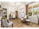Inviting foyer with a statement window, stylish furnishings, and a grand grandfather clock at 3402 Melissa Country Way, Lutz, FL 33559