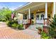 Inviting front porch with a brick walkway and decorative accents at 3402 Melissa Country Way, Lutz, FL 33559