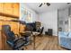 Inviting office area with wood flooring, natural light, ceiling fan, and cozy workspace with modern furnishings at 3402 Melissa Country Way, Lutz, FL 33559