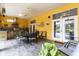 Covered patio with an outdoor kitchen, dining set, and view of the backyard at 3402 Melissa Country Way, Lutz, FL 33559