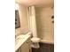 Bathroom with updated vanity, toilet, and shower with a neutral color palette at 4020 55Th N St # 1106, Kenneth City, FL 33709