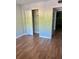 Cozy bedroom offers a closet and wood-look flooring, perfect for comfort and convenience at 4020 55Th N St # 1106, Kenneth City, FL 33709