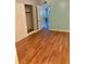 Bedroom with wood-look floors and a closet provides ample storage at 4020 55Th N St # 1106, Kenneth City, FL 33709