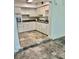 Bright eat-in kitchen with white cabinets, stainless appliances, and modern countertops for a functional cooking space at 4020 55Th N St # 1106, Kenneth City, FL 33709